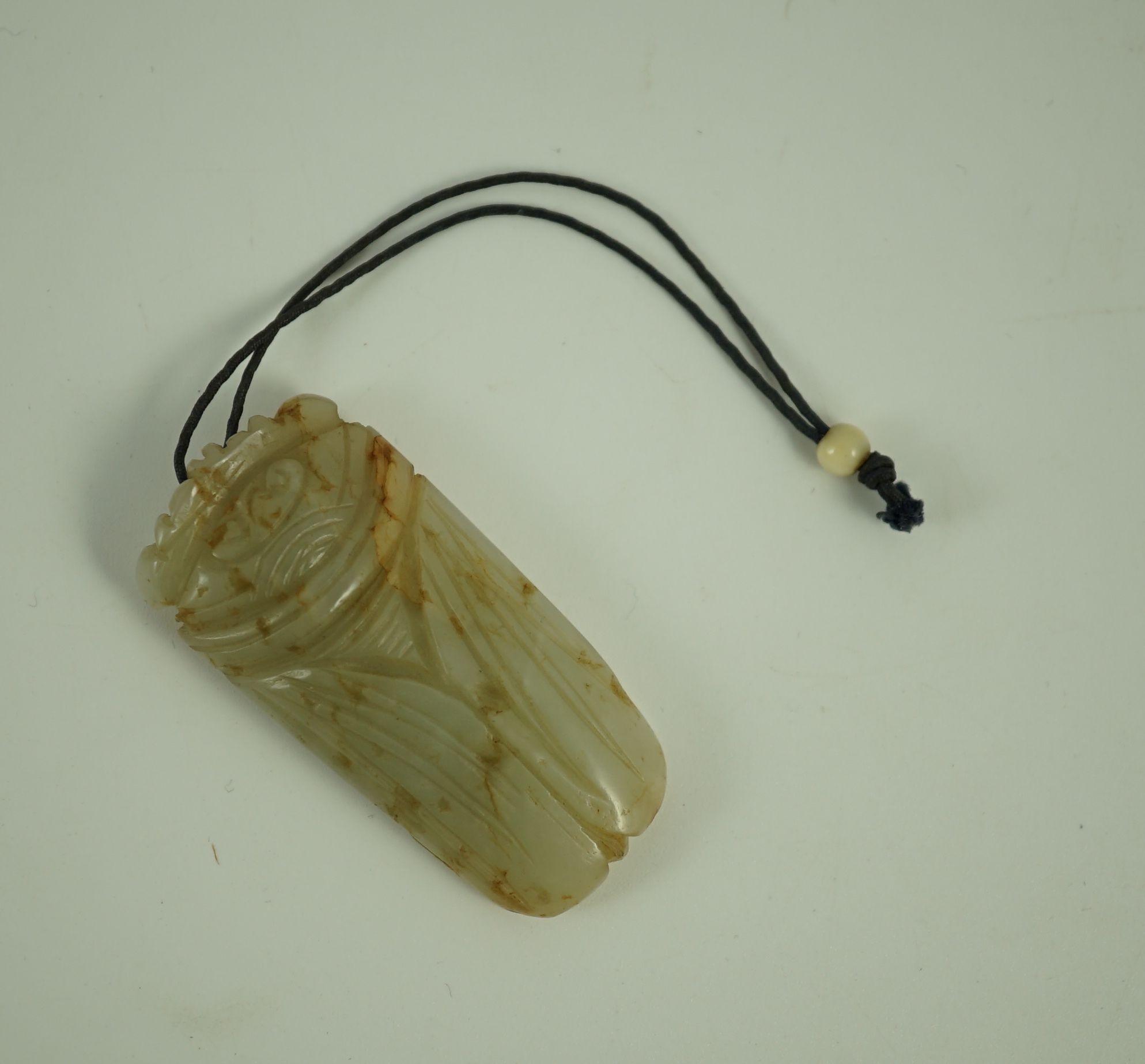 A Chinese pale celadon jade model of a cicada, 19th century, Cicada 5cms long. 4.9cm long